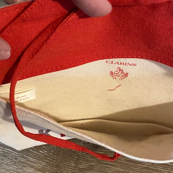 Clarins x FEED NWOT Cultivate Kindness Canvas Clutch with Red Accents 8.5x5.5 - Picture 4 of 5